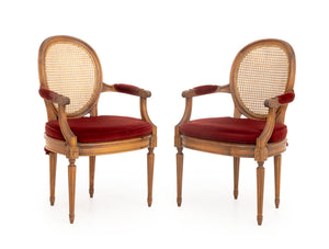Pair of Louis XVI Style Red Velvet Upholstered Cane Paneled Walnut Fauteuils