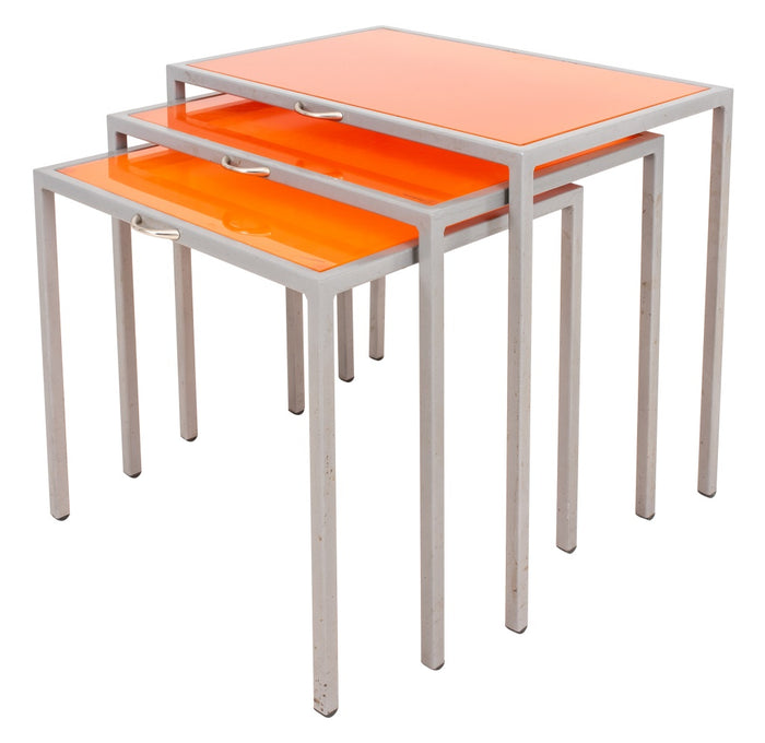 Modernist orange glass and steel nesting tables, Set of Three