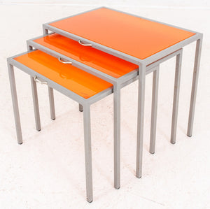 Modernist orange glass and steel nesting tables, Set of Three (8344657428787)