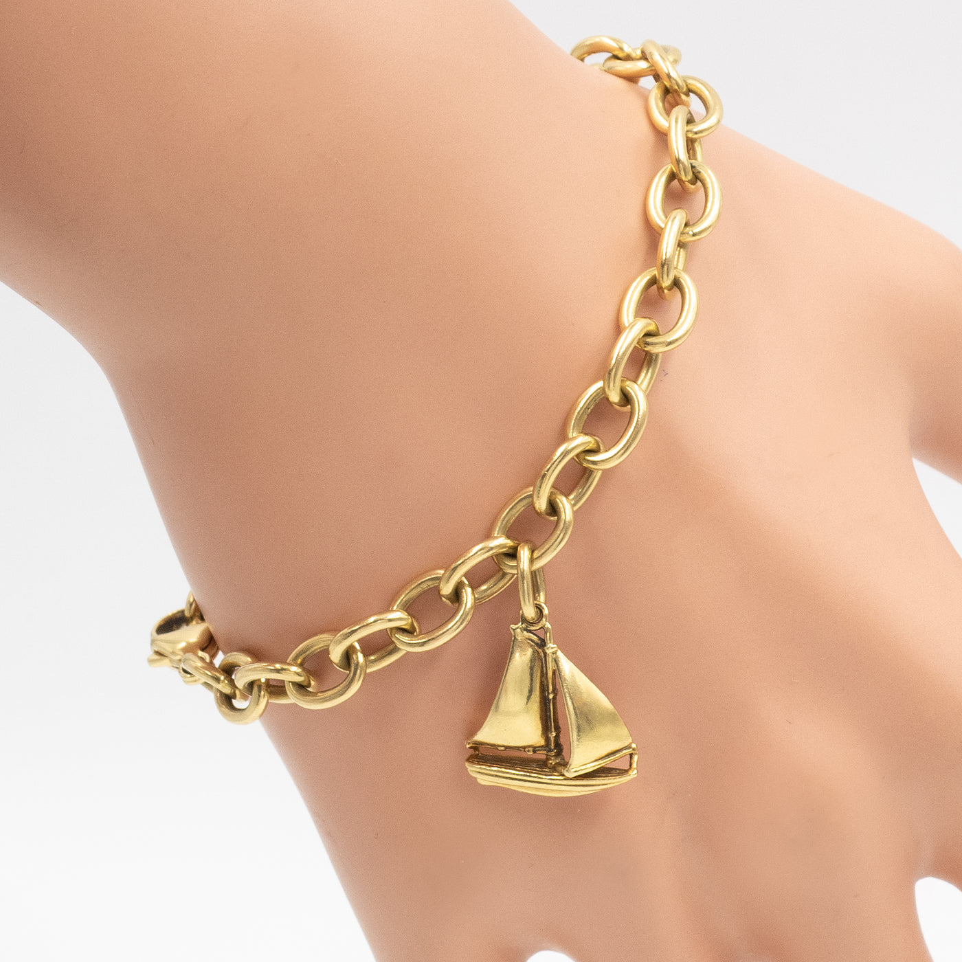 Gold Charm Bracelet, Tiffany & Co..  Estate Jewelry Bracelets, Lot  #58032