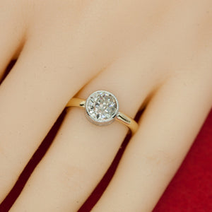 Ring in Platinum and Gold with Bezel-Set Solitaire Diamond